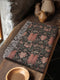 Luxurious woven cotton throw blanket featuring symmetrical scarab beetle pattern in terracotta on black background with white fringe detail. Perfect as gothic wall tapestry, dark academia decor, or cottagecore blanket for bedroom or living room.